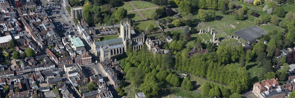 Bury St Edmunds from the air, with the abbey gardens among the rooftops.
